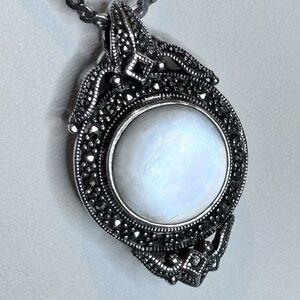 Elegant Silver Pendant Necklace.  Double sided MOP/Onyx pendant.  Beautiful